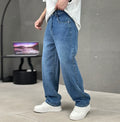 Men's washed grey straight leg jeans paired with white trainers for casual everyday styling inspiration