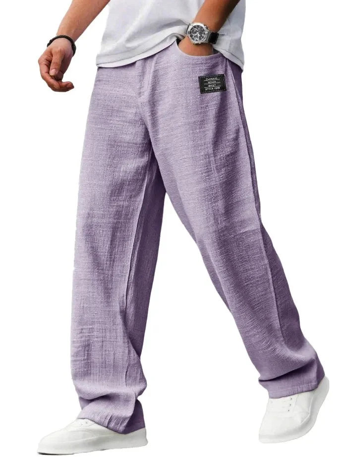 Waistband detail of men's straight leg trousers with mid-rise cut and relaxed styling