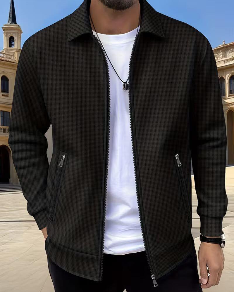 Side profile of men's textured zip-up jacket highlighting relaxed fit and ribbed cuffs detail