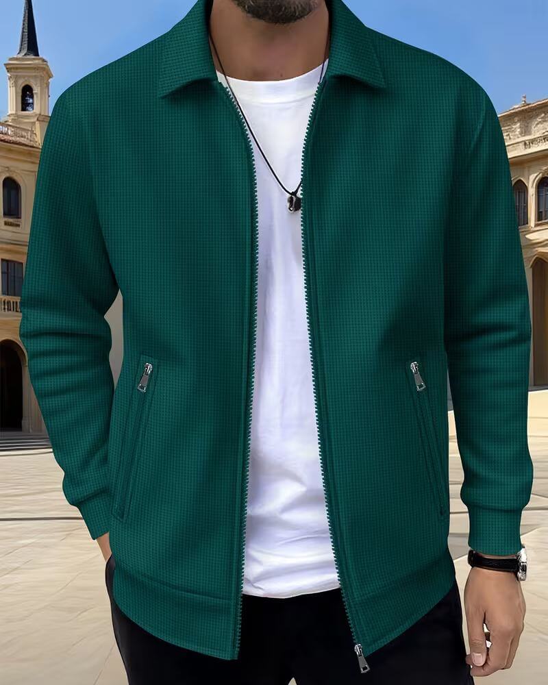 Detail shot of men's jacket zip pockets and structured textured fabric finish