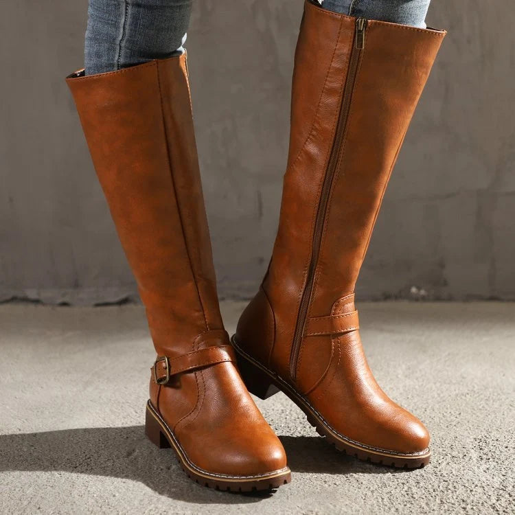 Women's knee-high boots paired with denim for versatile casual styling