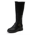 Close-up of women's knee-high boots showing smooth finish and ankle buckle strap