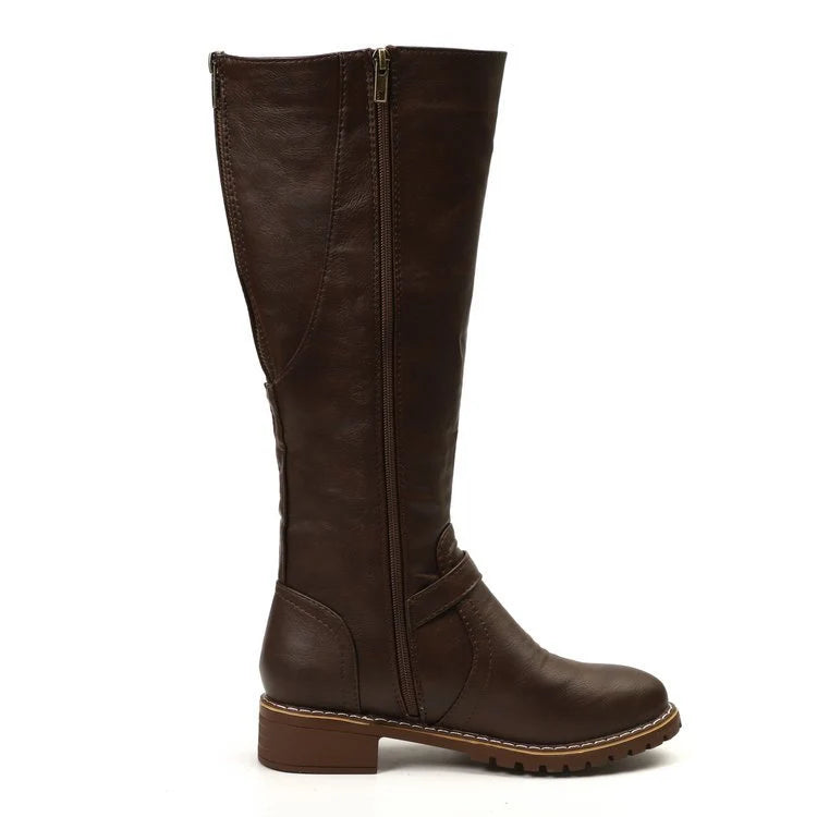 Detail shot of women's knee-high boots showing stitching and buckle hardware