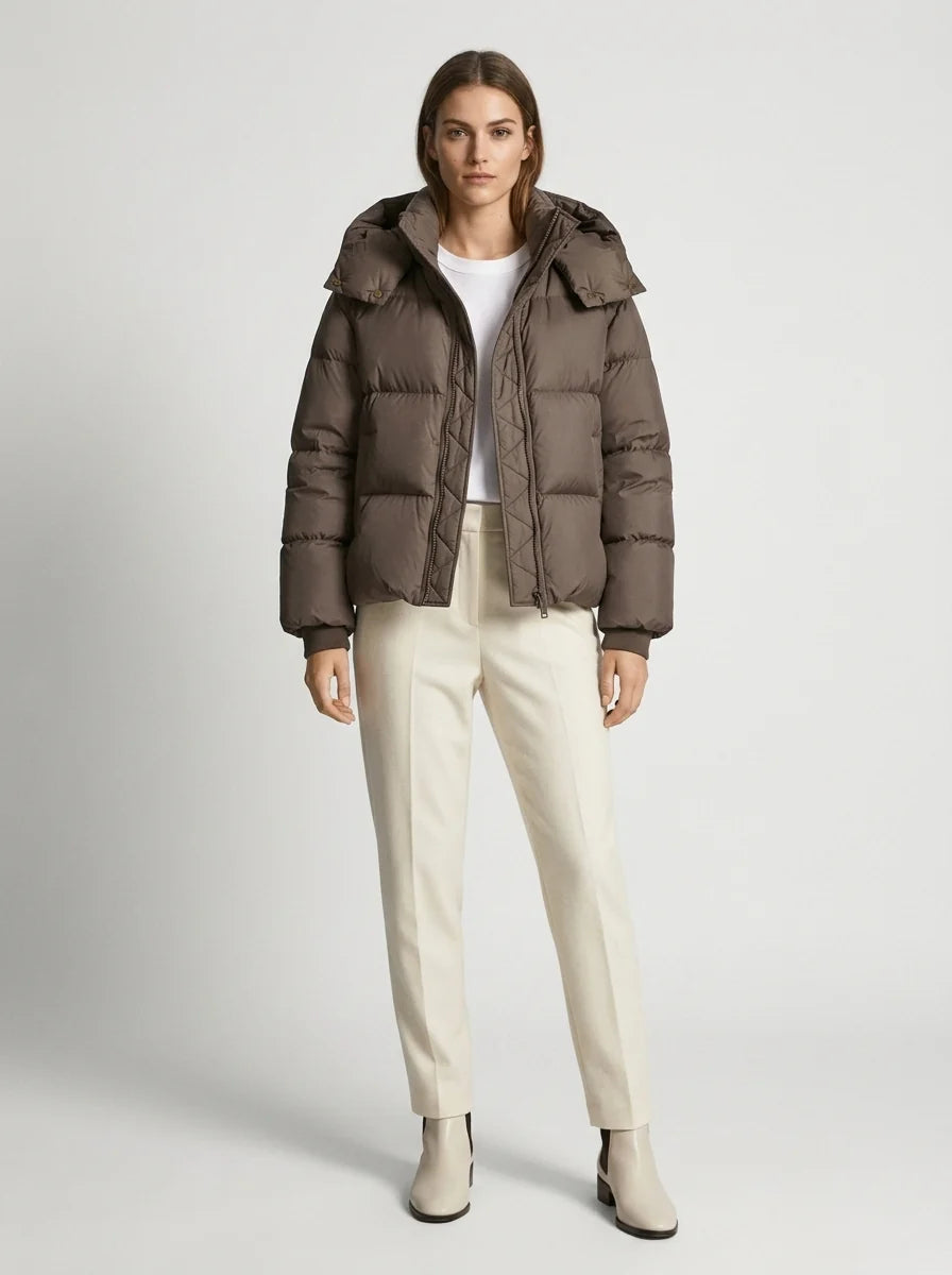 Cropped puffer jacket flat lay showing oversized proportions and ribbed cuff details