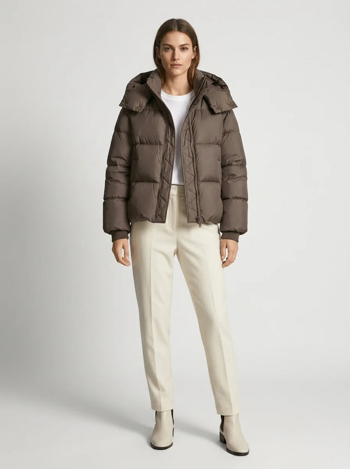 Cropped puffer jacket flat lay showing oversized proportions and ribbed cuff details
