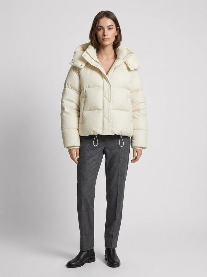 Women's oversized puffer jacket collar and hood detail with snap-button closure