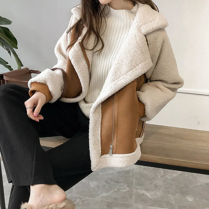 Woman wearing women's oversized sherpa jacket in bronze with fleece lining and zip-up front