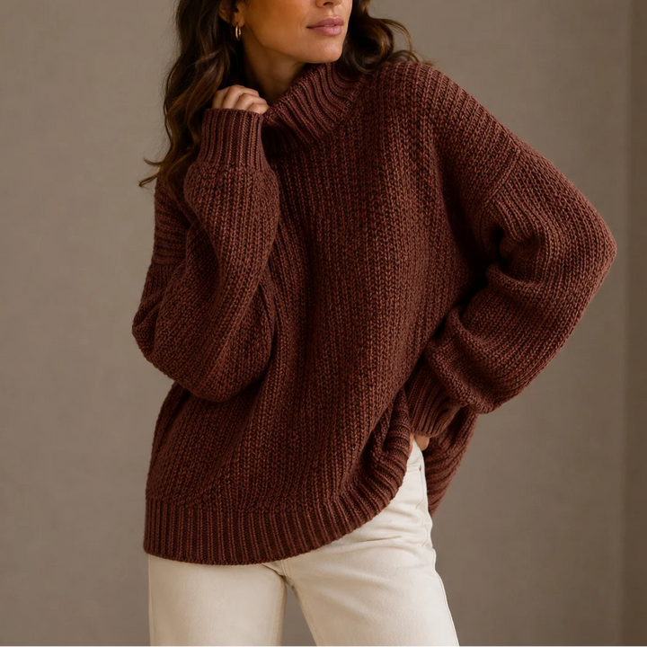 Women's chunky knit turtleneck jumper styled with cream trousers for casual autumn outfit