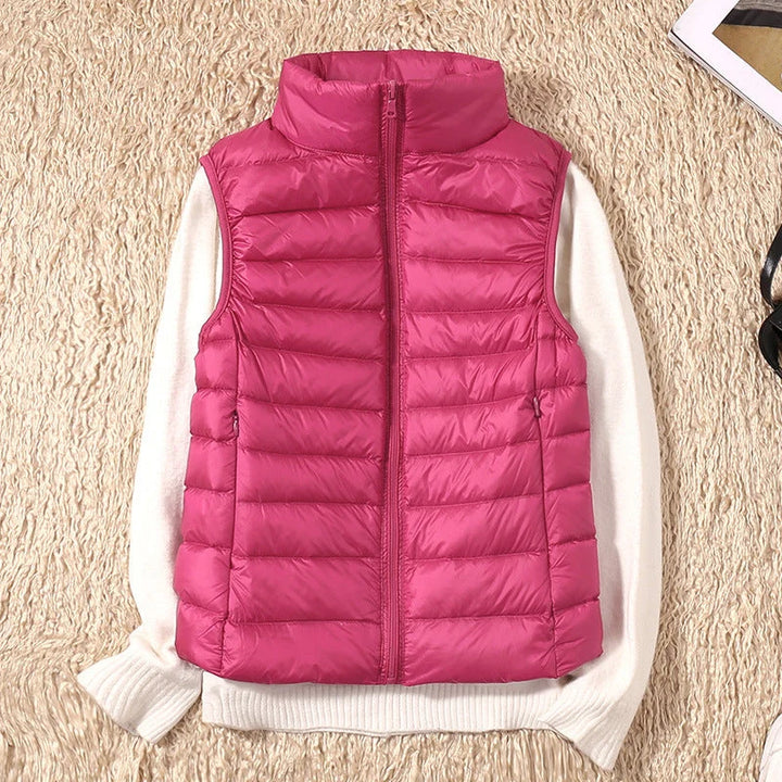 Close-up of quilted fabric texture and padded channels on women's sleeveless puffer gilet