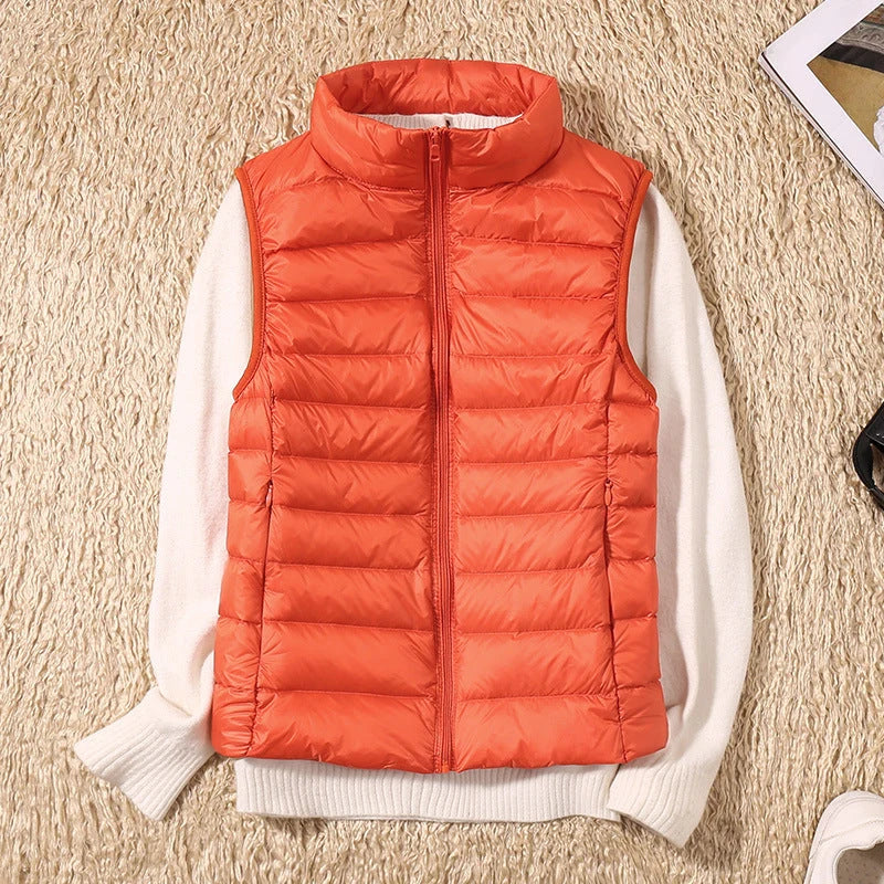 Women's rose gold quilted gilet showing fitted silhouette and structured padded design