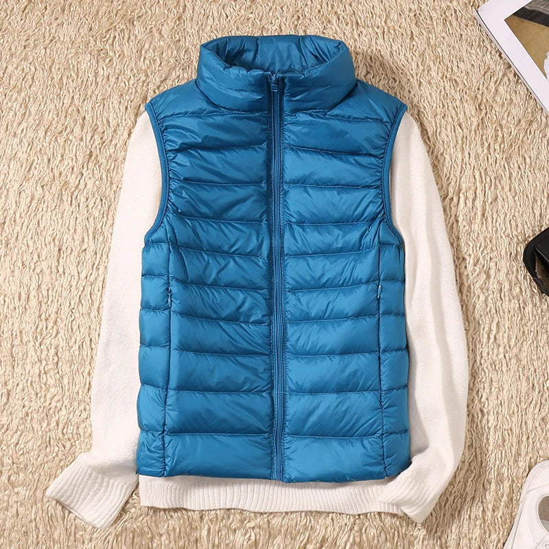 Full-length view of women's sleeveless quilted gilet with stand collar and zip-front closure