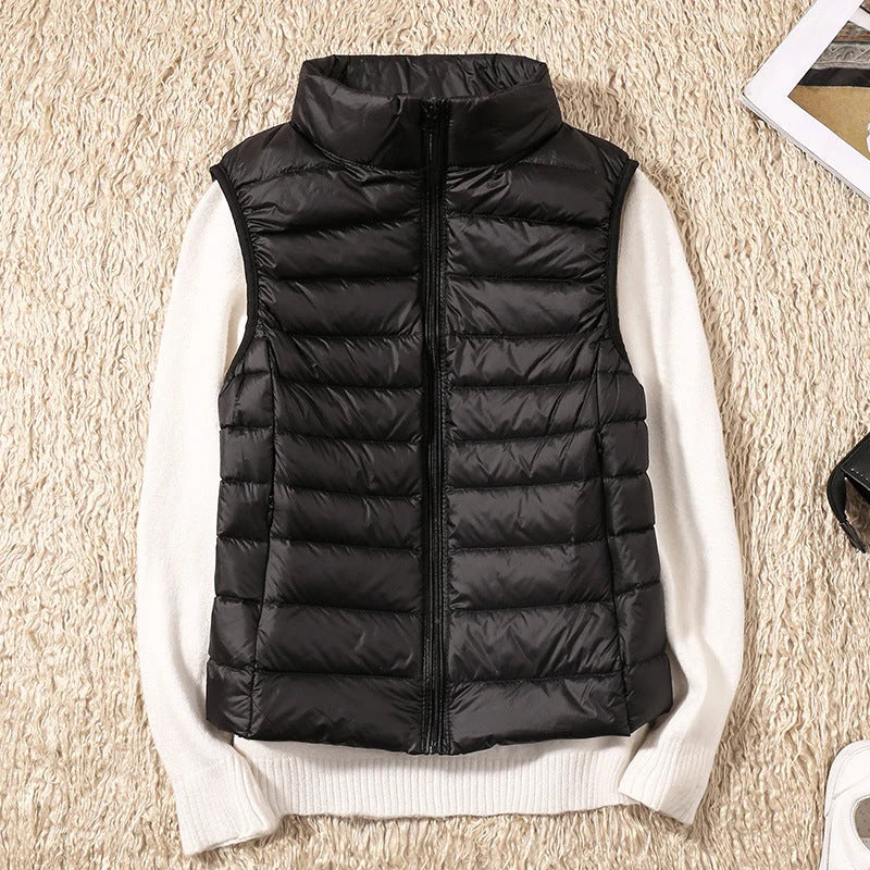 Side view of sleeveless quilted gilet in rose gold, displaying fitted silhouette and hip-length cut