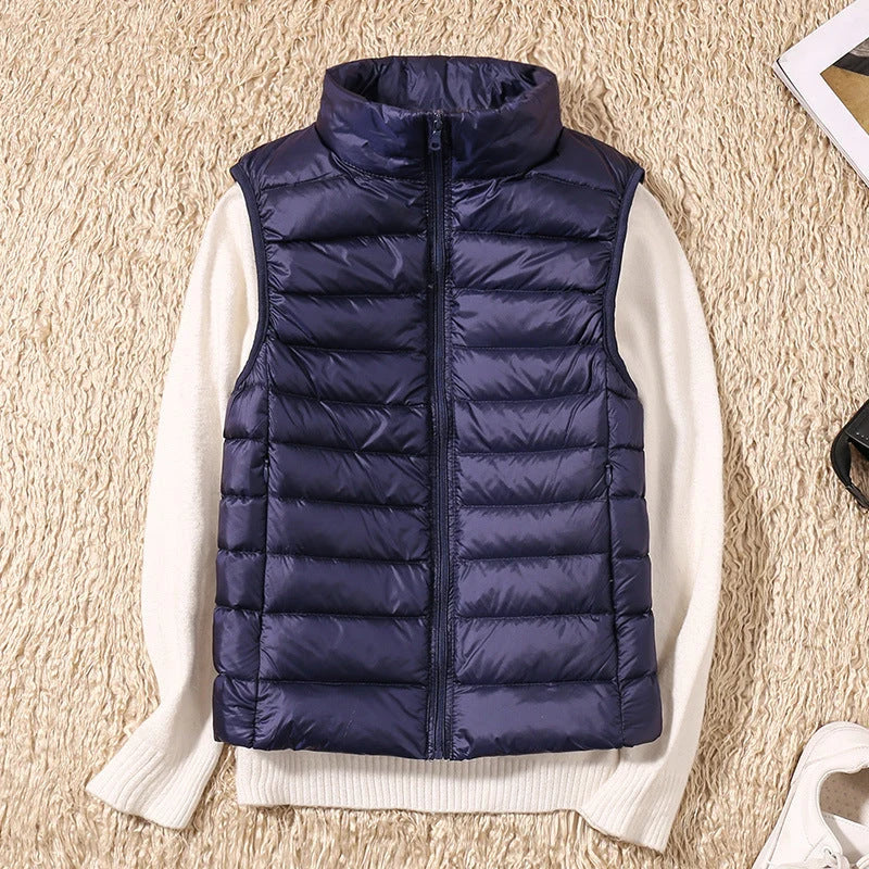 Back view of women's quilted gilet with horizontal quilted channels and fitted waist shape