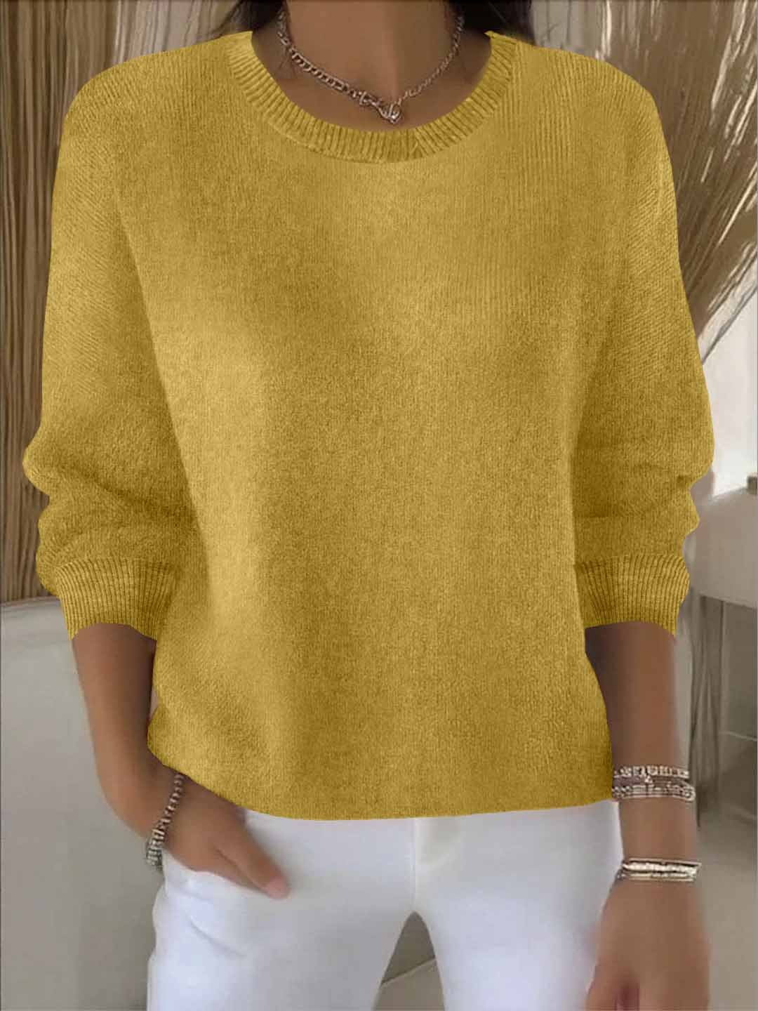 Women's relaxed knit jumper in mustard yellow with ribbed crew neckline and three-quarter sleeves