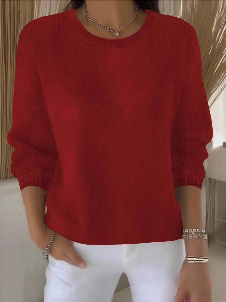 Women's relaxed jumper in light blue with ribbed detailing at neckline, cuffs, and hem