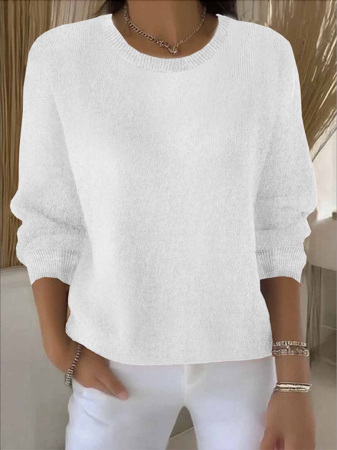 Close-up view of women's cropped knit jumper showing fine-gauge knit texture and ribbed detailing