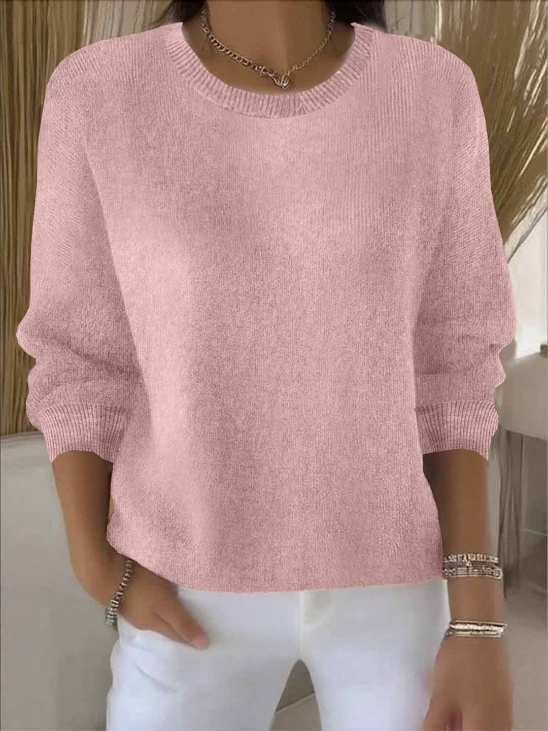 Women's crew neck jumper in white showing ribbed neckline and smooth knit finish