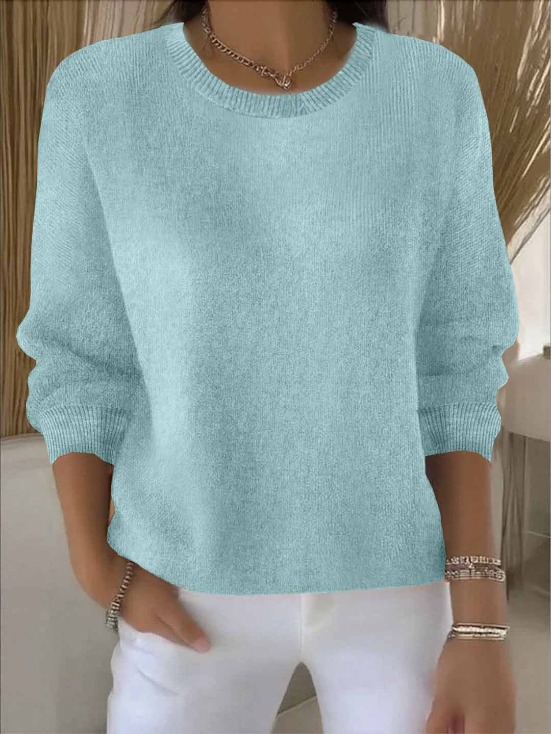 Women's cropped jumper in khaki green paired with casual trousers for daywear styling