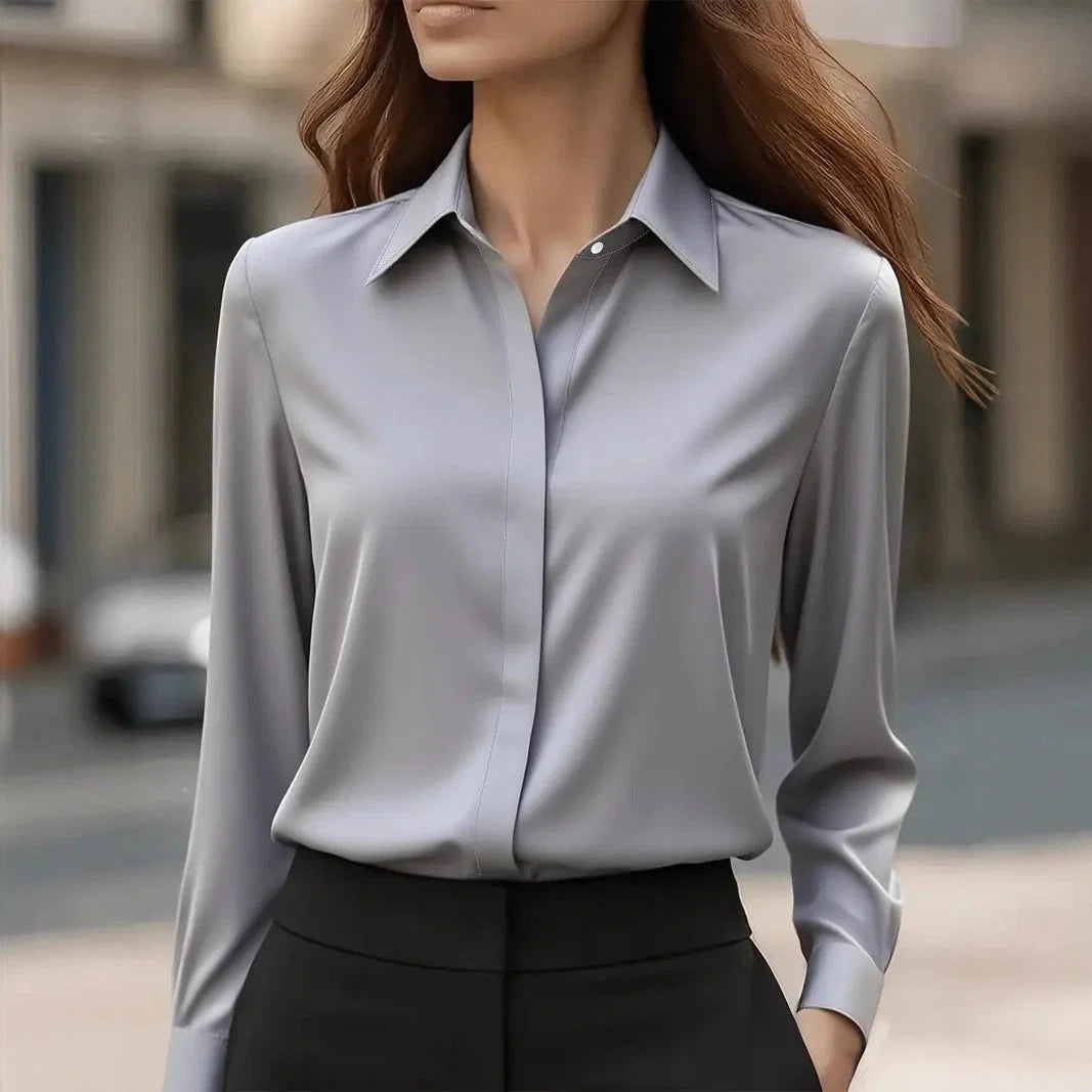 Side angle of women's long sleeve blouse with tailored fit and structured silhouette