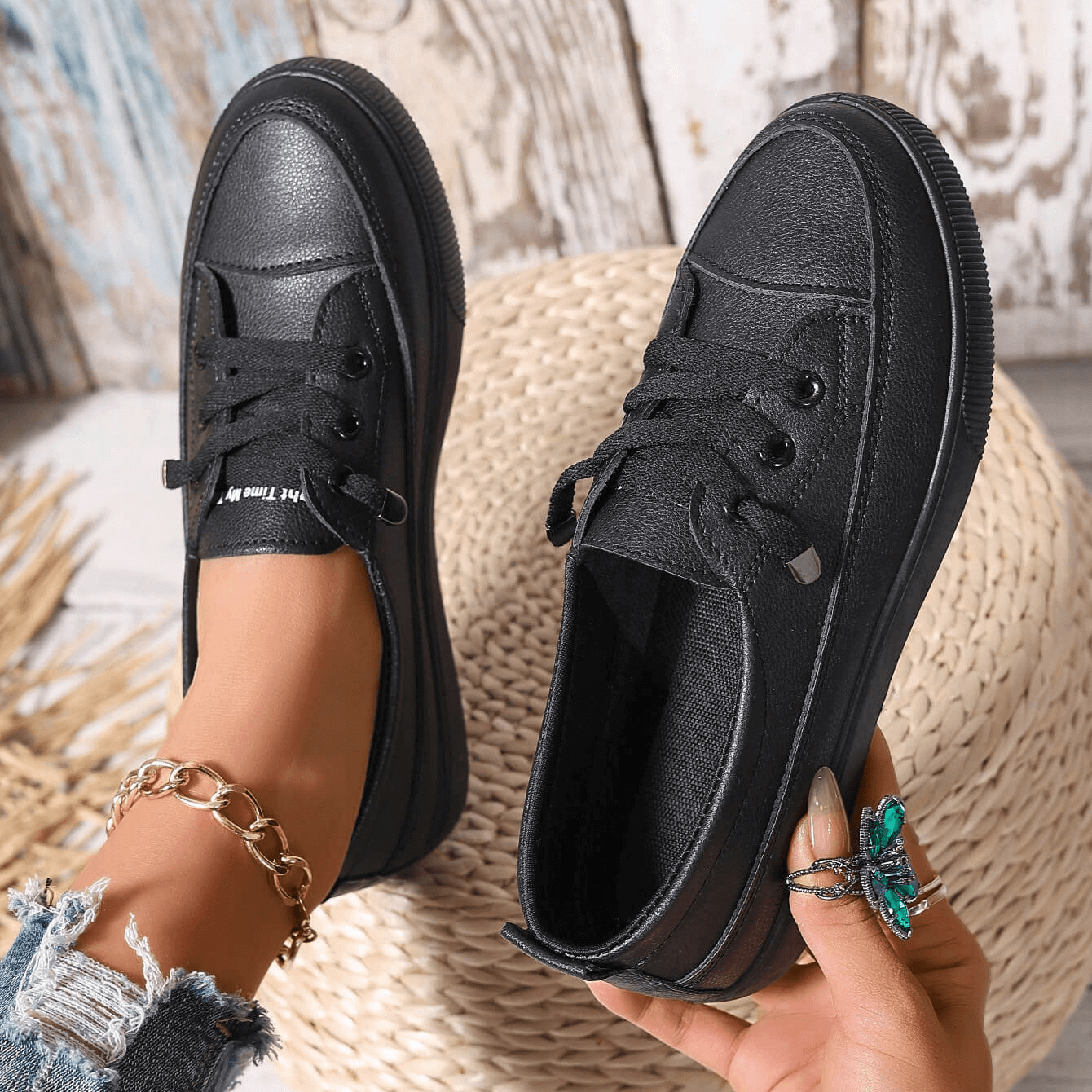Women's white trainers on foot showing platform sole height and casual styling