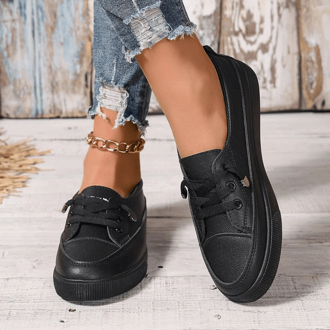White platform trainers showing structured upper and supportive fit for daily movement