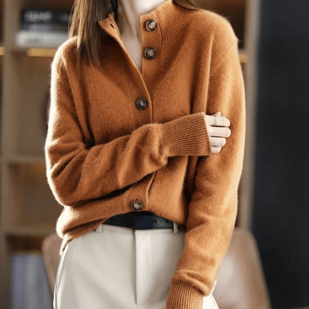 Side profile of button front cardigan with hip-length coverage and relaxed fit