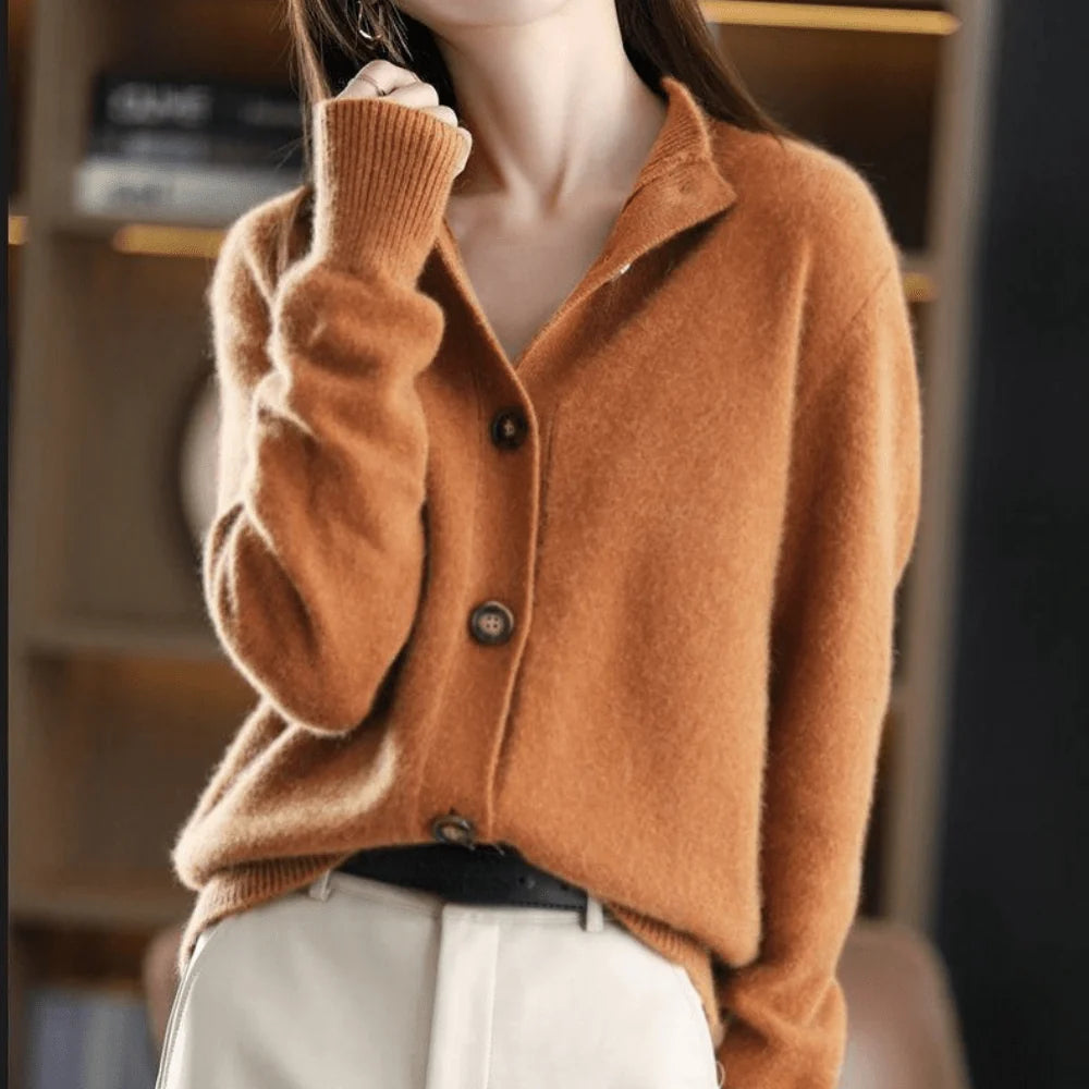 Close-up view of button front knit cardigan showing contrast button detail and collar