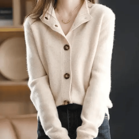 Side view of women's hip-length knit cardigan with relaxed fit silhouette