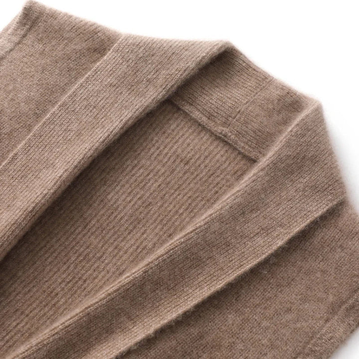 Woman wearing the cashmere vest with the tie belt loosely draped for casual styling