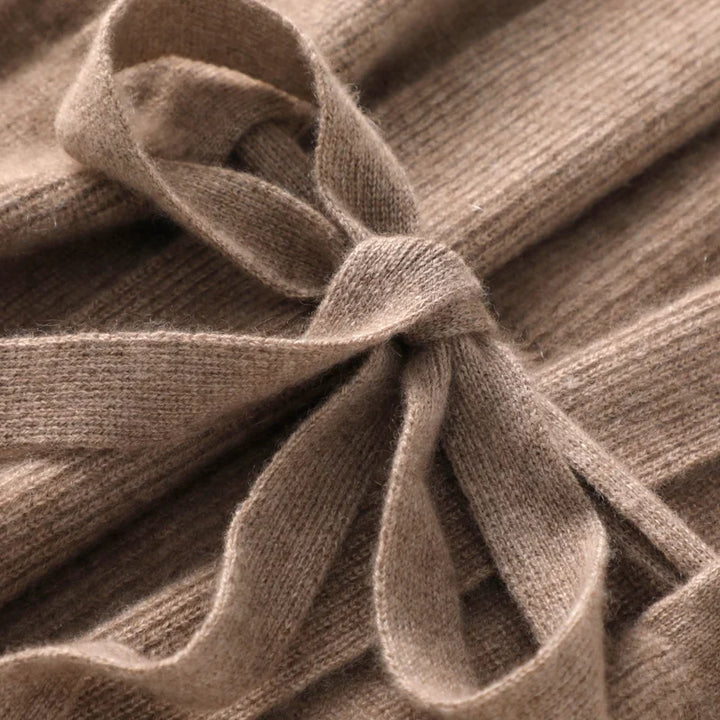 Back view showing the sleeveless cut and ribbed knit pattern of the vest