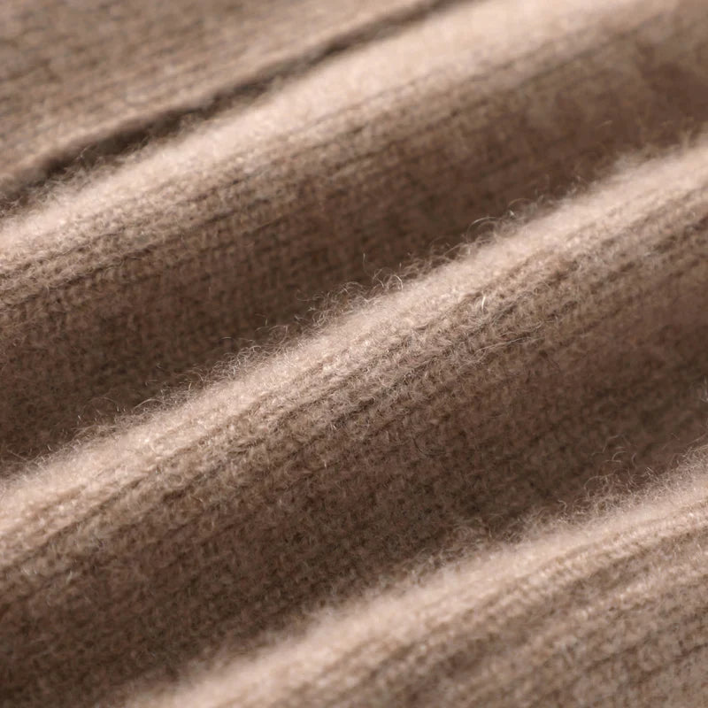 Close-up of the open front neckline and soft knit construction on the vest
