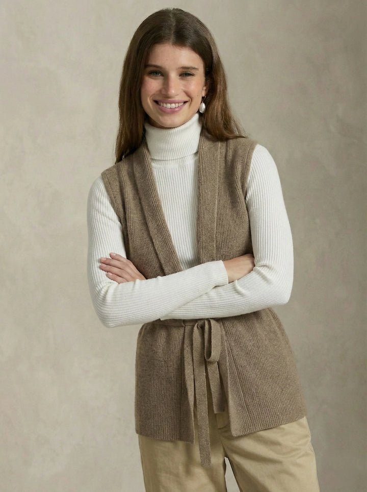 Close-up of the soft ribbed knit fabric and sleeveless armholes on the vest