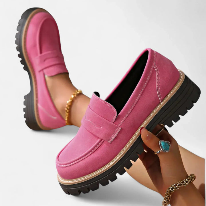 Side profile of women's chunky loafers displaying thick ridged sole and supportive construction