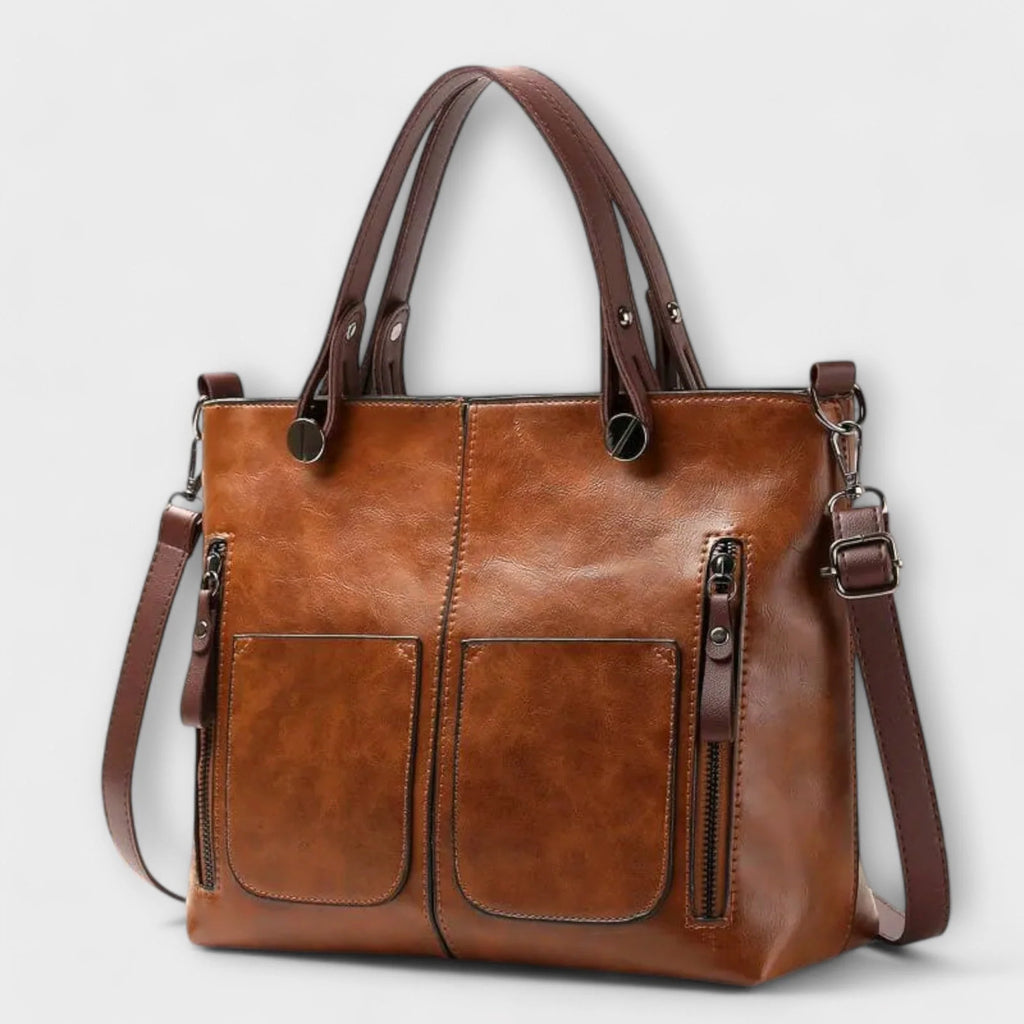 Women's structured tote bag in tan with dual front pockets and top handles