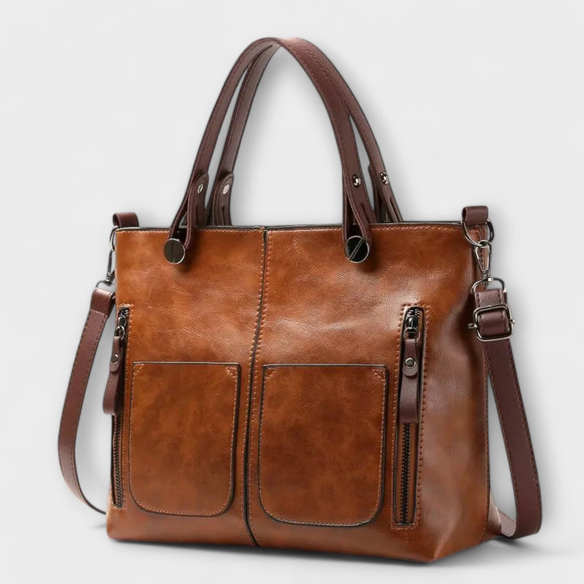 Women's structured tote bag in tan with dual front pockets and top handles