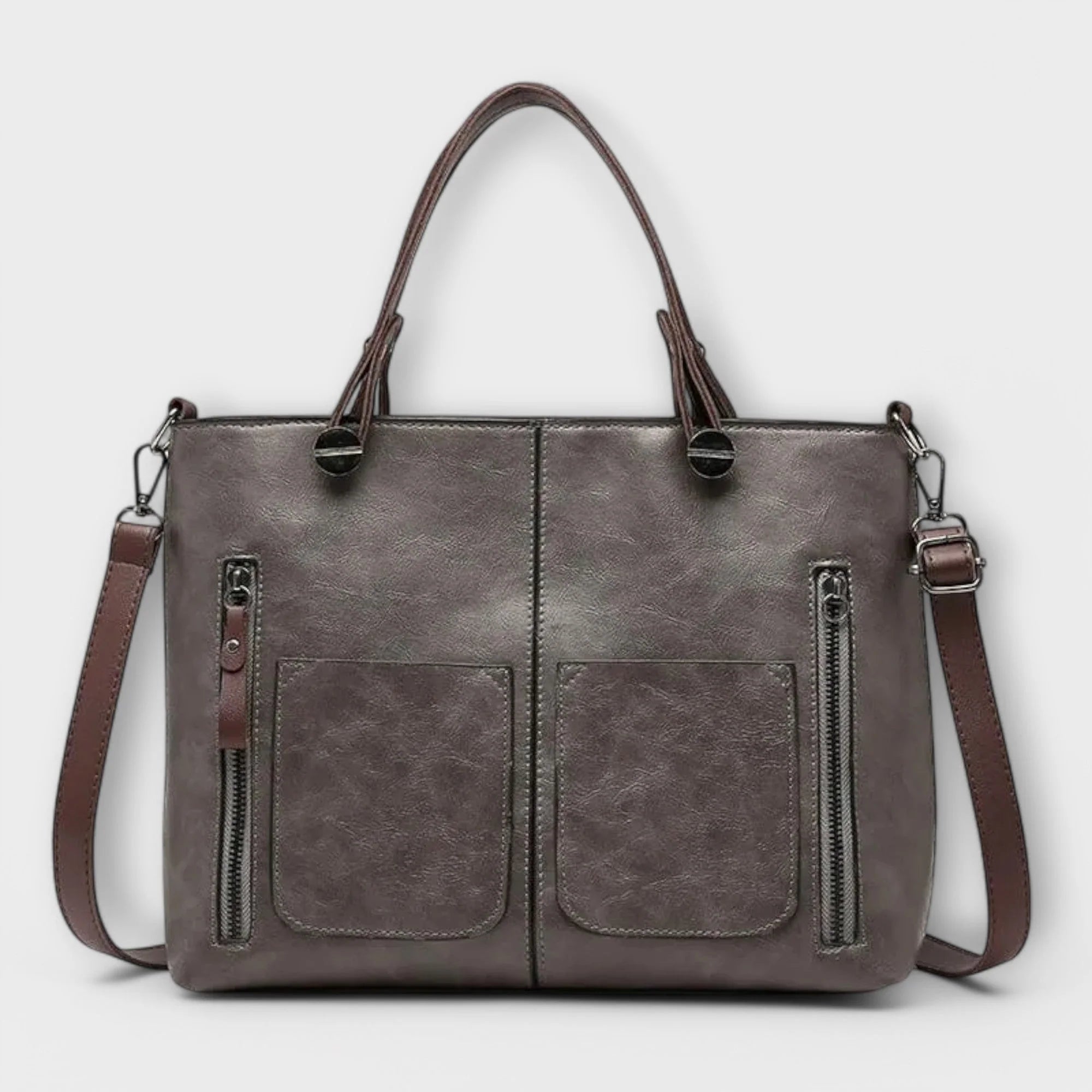 Side view showing adjustable shoulder strap and structured silhouette of women's tote