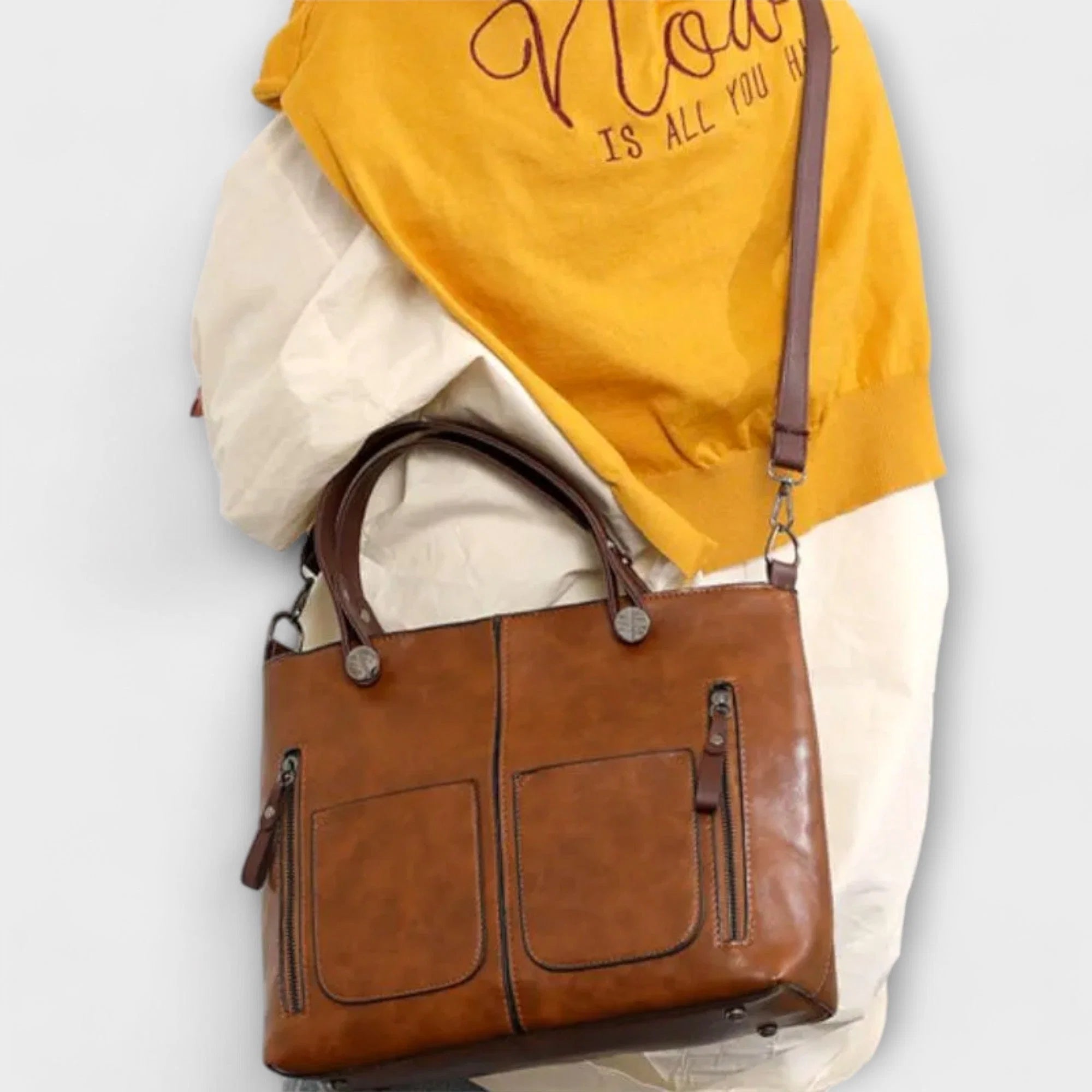 Top view of tote bag interior compartment with dual handles and secure closure