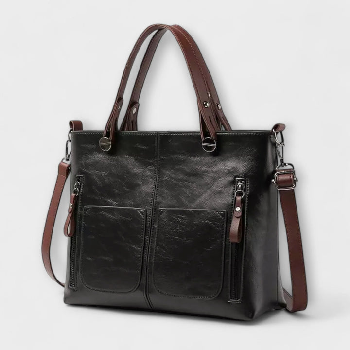 Close-up of tote bag handles and top opening with reinforced stitching detail