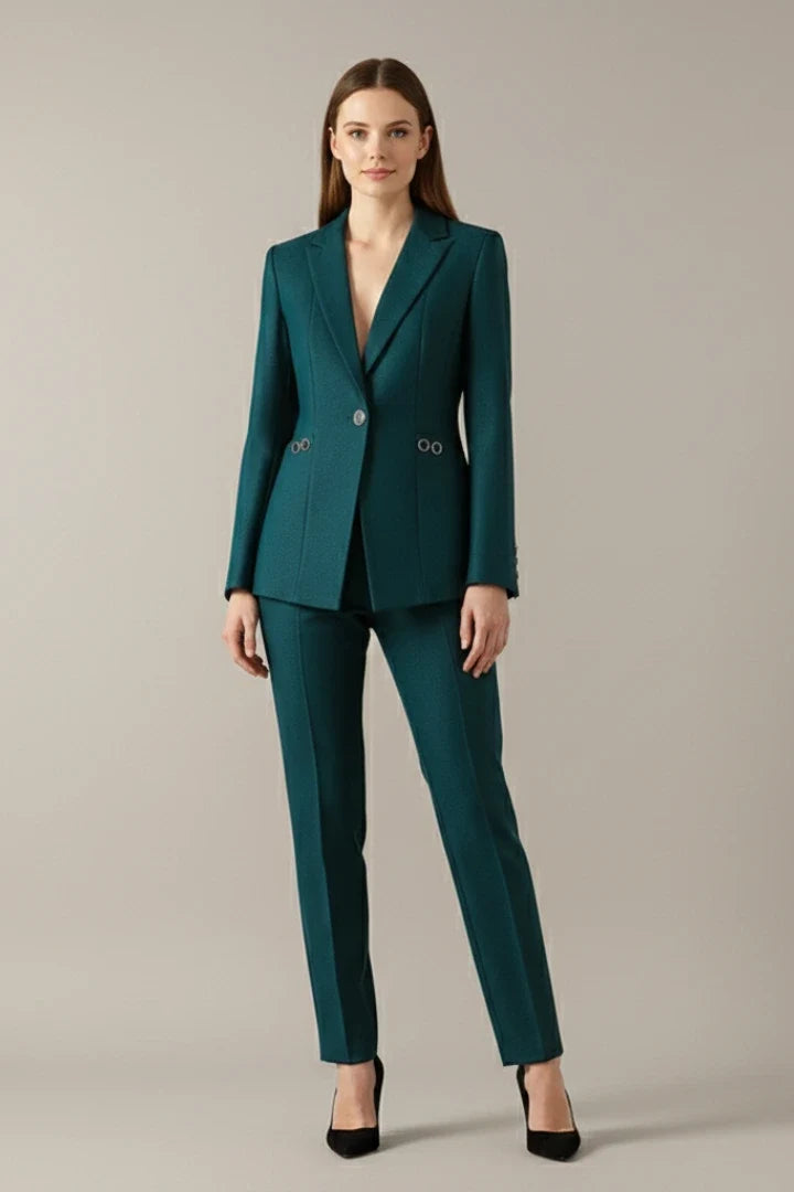 Deep teal women's blazer with notched lapels, structured shoulders, and gold-tone ring details at waist