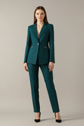 Deep teal women's blazer with notched lapels, structured shoulders, and gold-tone ring details at waist