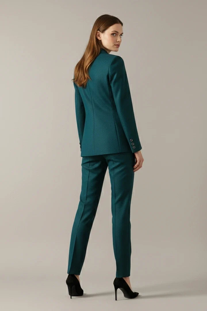 Women's teal blazer set showing single-button front closure and matching trouser co-ord for formal occasions