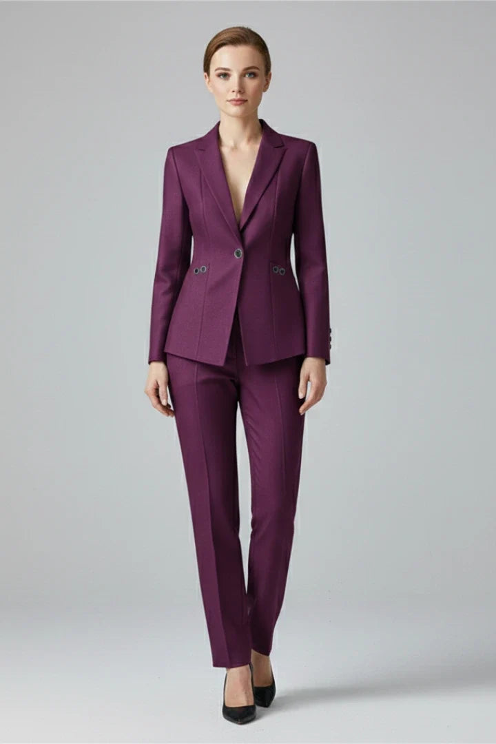 Women's tailored two-piece suit in teal showing blazer with lapels and matching formal trousers