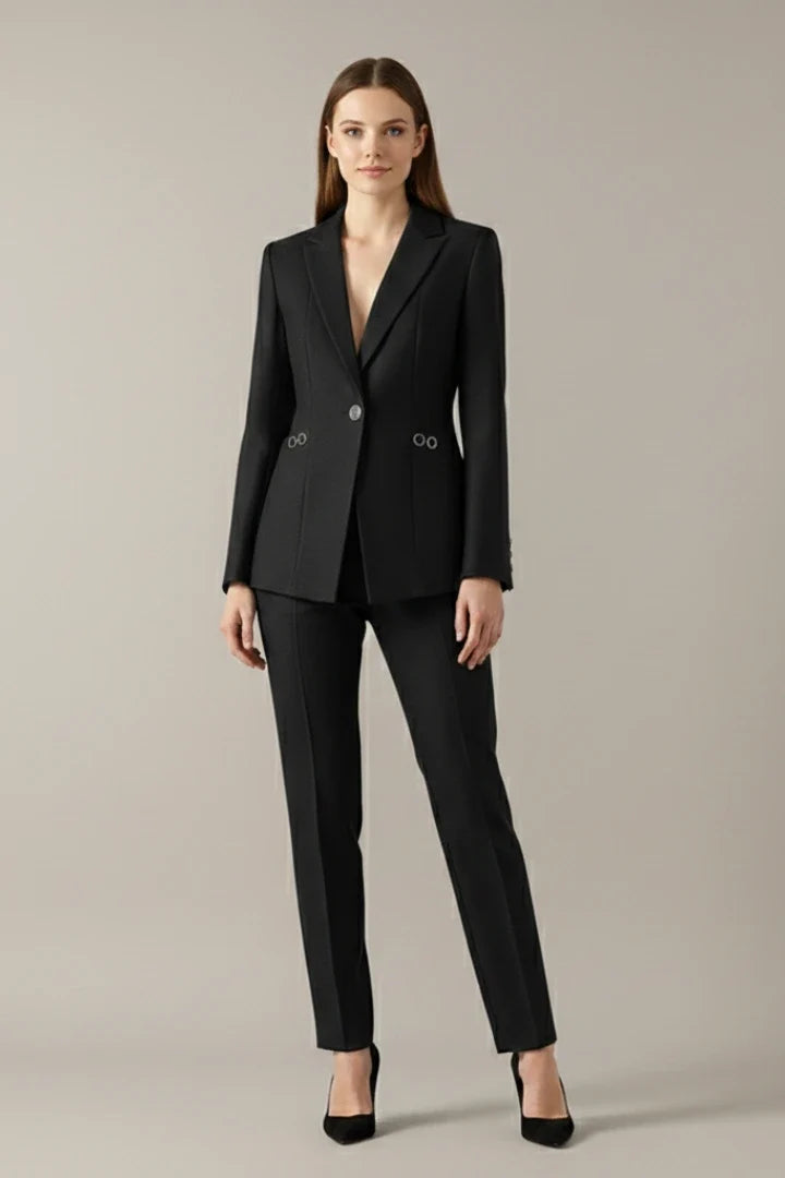Teal women's blazer and trouser set with structured shoulders and straight-leg cut for work and evening