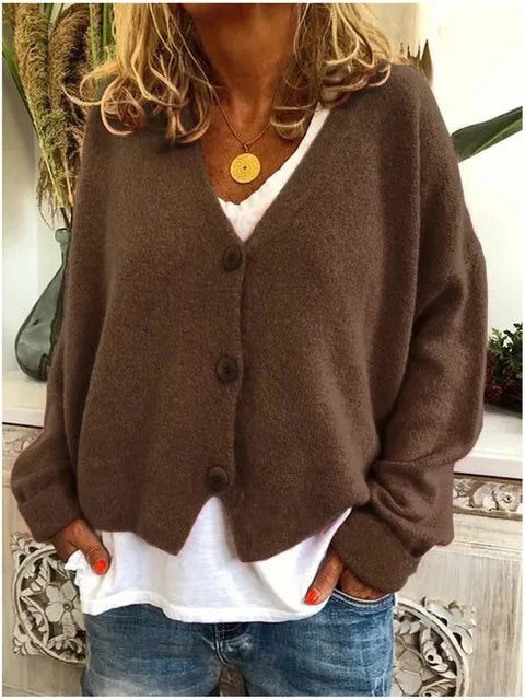 Close-up view of soft knit cardigan showing button-front closure and relaxed fit