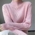 Women's cable knit turtleneck jumper in pink with ribbed neckline and textured front pattern