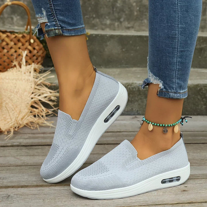 Mesh platform trainers worn with black leggings showing slip-on fit and platform height