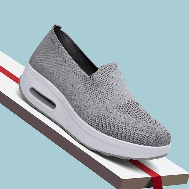 Navy blue mesh platform trainers with white air sole and supportive platform design