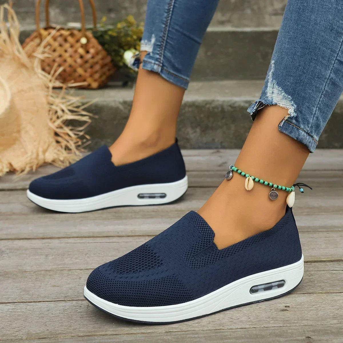 Detail of mesh platform trainers showing breathable knit construction and elasticated opening