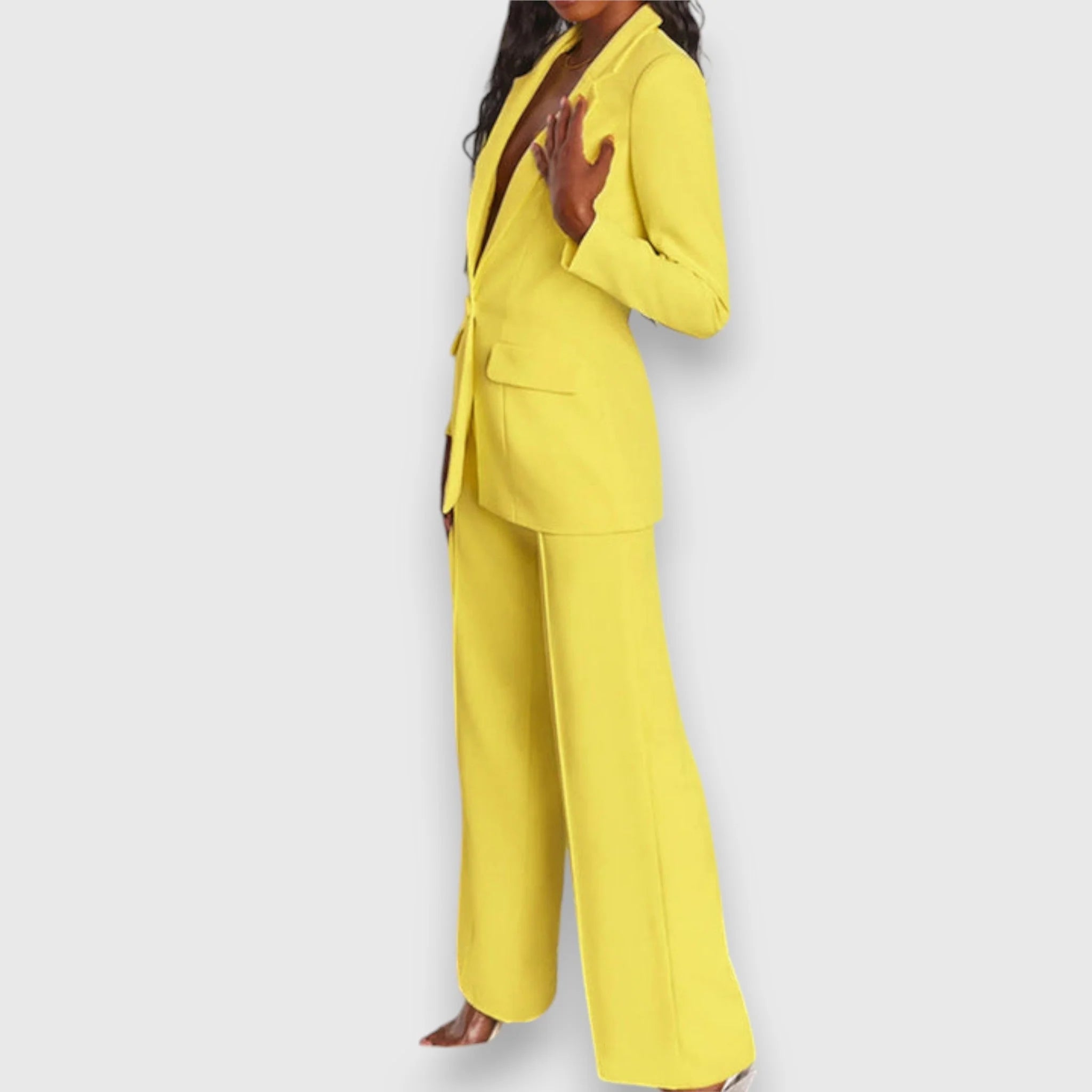 Close-up of blazer lapel detail and smooth fabric finish on women's suit