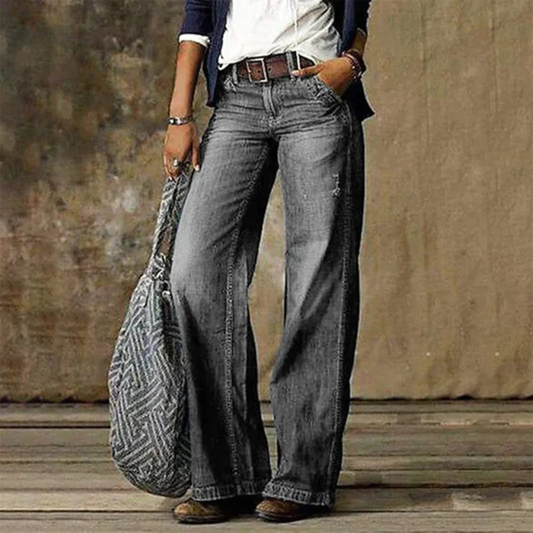 Side view of relaxed fit wide leg jeans with mid rise waist and straight leg silhouette